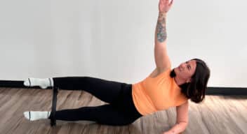 Woman doing a Pilates exercise with a pilates ring
